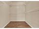 Walk-in closet with wood-look tile floors and wire shelving on all sides at 208 Lake Region S Blvd, Winter Haven, FL 33881
