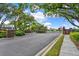 Gated community entrance with lush landscaping, brick pillars, and secure access for residents and visitors at 208 Lake Region S Blvd, Winter Haven, FL 33881
