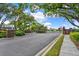 Gated entrance to the community with landscaped surroundings and brick features enhancing curb appeal at 208 Lake Region S Blvd, Winter Haven, FL 33881