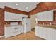 Spacious kitchen with white cabinets, appliances, and tile flooring at 208 Lake Region S Blvd, Winter Haven, FL 33881