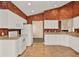 Bright kitchen with white cabinets, tile floors, and modern appliances at 208 Lake Region S Blvd, Winter Haven, FL 33881
