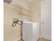 The laundry room includes a white dryer and wire shelving at 208 Lake Region S Blvd, Winter Haven, FL 33881
