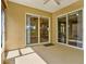 The patio features sliding glass doors to the home's interior at 208 Lake Region S Blvd, Winter Haven, FL 33881
