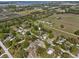 Aerial view showing the house needing major repairs with greenery nearby at 215 10Th Wahneta W St, Winter Haven, FL 33880