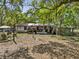 Messy backyard with old buildings and debris at 215 10Th Wahneta W St, Winter Haven, FL 33880