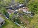 Exterior view showcasing a home in need of considerable maintenance and landscaping at 215 10Th Wahneta W St, Winter Haven, FL 33880