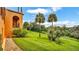 Expansive backyard with lush green lawn and mature trees at 2300 N Scenic Hwy # 56, Lake Wales, FL 33898