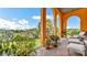 Charming outdoor balcony featuring comfortable seating, potted plants, and scenic views of the surrounding greenery at 2300 N Scenic Hwy # 56, Lake Wales, FL 33898