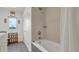 Well-lit bathroom featuring a shower-tub combination with decorative tile and natural light at 2300 N Scenic Hwy # 56, Lake Wales, FL 33898