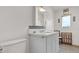 Bathroom with modern vanity, stylish fixtures, decorative tile, and a large illuminated mirror at 2300 N Scenic Hwy # 56, Lake Wales, FL 33898