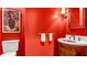 Powder room features a barrel sink and red walls at 2300 N Scenic Hwy # 56, Lake Wales, FL 33898