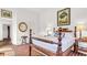 Bedroom with brick floors, white walls, and vintage furnishings creating a cozy space at 2300 N Scenic Hwy # 56, Lake Wales, FL 33898