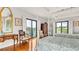 Bedroom with hardwood floors, private balcony, bright airy windows and two beds at 2300 N Scenic Hwy # 56, Lake Wales, FL 33898