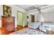 Bedroom with hardwood floors and twin beds with canopy at 2300 N Scenic Hwy # 56, Lake Wales, FL 33898