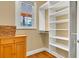 Walk-in closet with built-in shelves at 2300 N Scenic Hwy # 56, Lake Wales, FL 33898