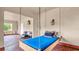 Enclosed patio featuring a hanging day bed and furniture at 2300 N Scenic Hwy # 56, Lake Wales, FL 33898