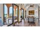 Dining room featuring tile flooring, large windows, and an outdoor terrace with furniture at 2300 N Scenic Hwy # 56, Lake Wales, FL 33898