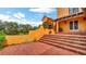 Backyard patio with steps to a garden at 2300 N Scenic Hwy # 56, Lake Wales, FL 33898