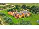 Stunning aerial view of a custom home with lush landscaping and a private pool at 2300 N Scenic Hwy # 56, Lake Wales, FL 33898