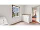 The laundry room features a decorative window, sink and cabinets at 2300 N Scenic Hwy # 56, Lake Wales, FL 33898