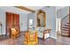 Living room featuring exposed wood beams, brick floors, a large mirror and wooden furniture at 2300 N Scenic Hwy # 56, Lake Wales, FL 33898