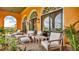 A covered patio offers a relaxing seating area with elegant furniture and views of the surrounding landscape at 2300 N Scenic Hwy # 56, Lake Wales, FL 33898