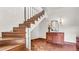 A vintage staircase with wood treads, risers, and banister, leading to upper floors at 2300 N Scenic Hwy # 56, Lake Wales, FL 33898