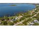 Aerial view of waterfront property showcasing the home's location on the water and surrounding community at 2350 Crump Rd, Winter Haven, FL 33881