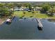 Aerial view of lakefront house and property with a pool and a boat dock at 2350 Crump Rd, Winter Haven, FL 33881