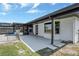Backyard concrete patio leading to a fenced dog run and screened in pool at 2350 Crump Rd, Winter Haven, FL 33881