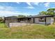 Backyard with a fenced dog run and an enclosed pool area at 2350 Crump Rd, Winter Haven, FL 33881