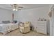Bedroom with white walls, ceiling fan, and tile floor at 2350 Crump Rd, Winter Haven, FL 33881