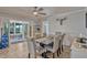 Cozy dining room with an adjoining sunroom, an attractive table set and access to outdoor space at 2350 Crump Rd, Winter Haven, FL 33881