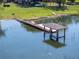 Wooden dock structure over the lake at 2350 Crump Rd, Winter Haven, FL 33881