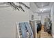 Laundry room featuring a washer, dryer, and clothing rack, as well as other utility items at 2350 Crump Rd, Winter Haven, FL 33881