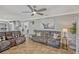 Spacious living room featuring tile floors, neutral decor, and plenty of seating at 2350 Crump Rd, Winter Haven, FL 33881
