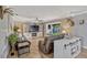 Comfortable living room with a large TV, cozy seating, and a charming window seat at 2350 Crump Rd, Winter Haven, FL 33881