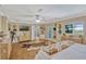 Spacious main bedroom with wood floors and neutral decor overlooking the pool at 2350 Crump Rd, Winter Haven, FL 33881