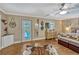 Bright main bedroom featuring wood floors and access to the pool at 2350 Crump Rd, Winter Haven, FL 33881