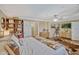 Spacious main bedroom featuring wood floors and stylish furnishings at 2350 Crump Rd, Winter Haven, FL 33881