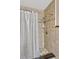 Shower with tile surround, shelf, and modern showerhead at 2350 Crump Rd, Winter Haven, FL 33881