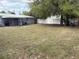 Spacious backyard with privacy fence and mature trees at 253 Walter Ave, Frostproof, FL 33843