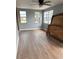 Bedroom with modern ceiling fan and three windows at 253 Walter Ave, Frostproof, FL 33843