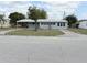 Charming single-story home with gray siding and a well-maintained front lawn at 253 Walter Ave, Frostproof, FL 33843