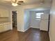 Kitchen with wood-look laminate floors and white cabinets at 253 Walter Ave, Frostproof, FL 33843