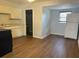 Bright eat-in kitchen with hardwood floors and white refrigerator at 253 Walter Ave, Frostproof, FL 33843