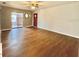 Open-concept living area with hardwood floors and access to a sliding glass door at 253 Walter Ave, Frostproof, FL 33843