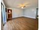 Spacious living room with hardwood floors and a ceiling fan at 253 Walter Ave, Frostproof, FL 33843