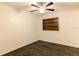 Bedroom showcasing wood-look flooring, a ceiling fan, and a built-in shelving at 3027 Maplewood Ave, Lakeland, FL 33803