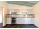 Updated kitchen featuring sleek cabinetry, stainless steel appliances, and elegant granite countertops at 3027 Maplewood Ave, Lakeland, FL 33803